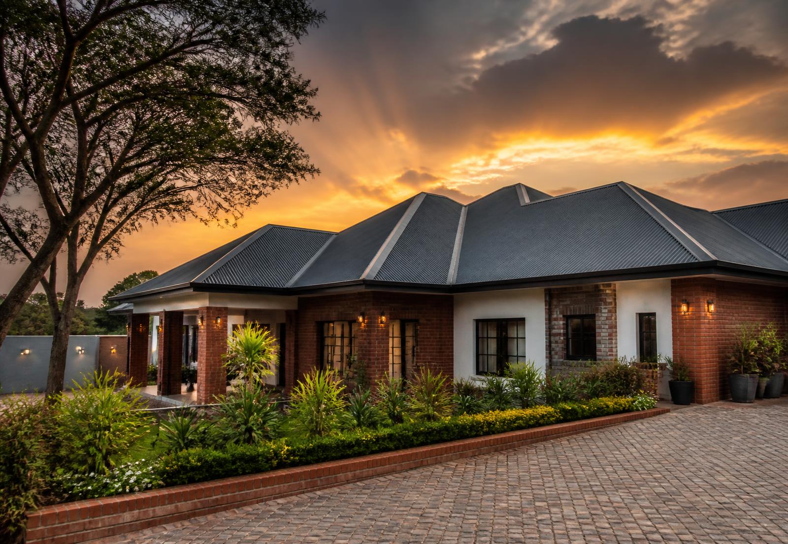 Premium Zimbabwean home with a new charcoal IBR roof at sunset